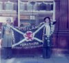 Carole  & Karen with banner Carole made Heidi for Christmas outside the Three Legs.jpg