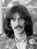 220px-George_Harrison_1974_edited.jpg