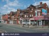 row-of-terraced-shops-princess-roadmoss-sidemanchester-C3TYT3.jpg